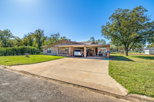 ranch-style home with a front yard and a carport