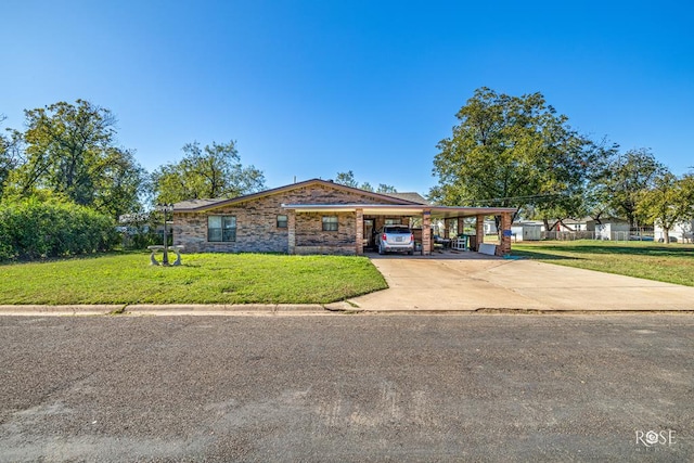 ranch-style home featuring a front yard and a carport