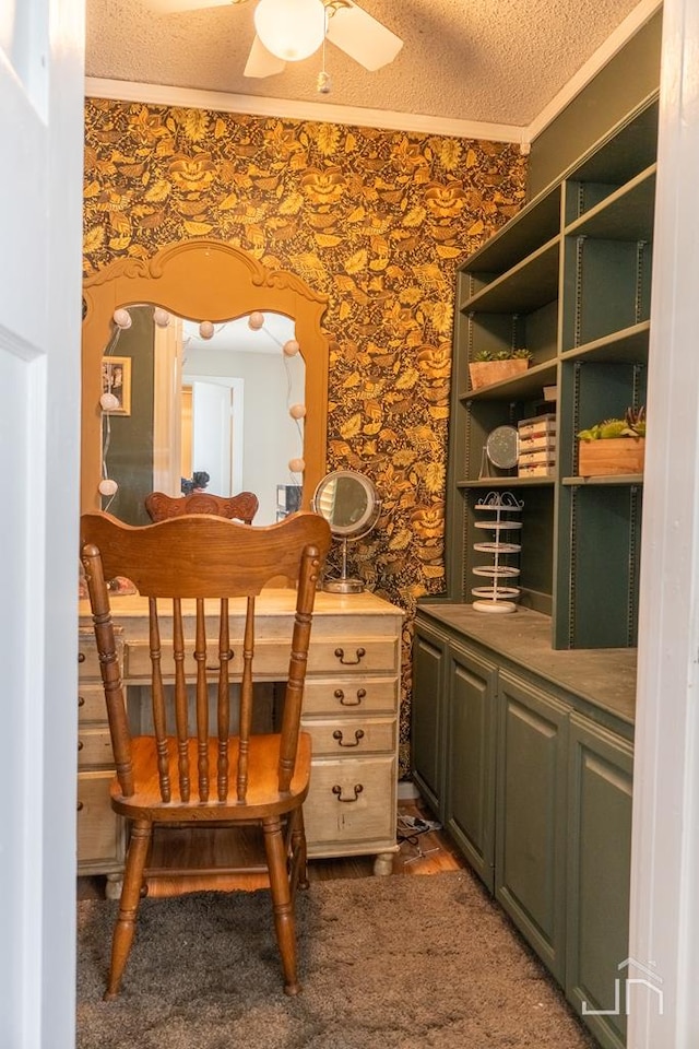 office space featuring wallpapered walls, crown molding, arched walkways, a textured ceiling, and a ceiling fan