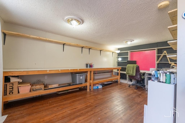 office with a textured ceiling and wood finished floors