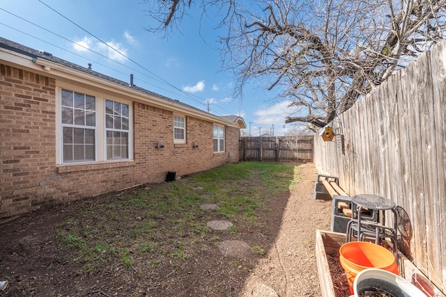 view of yard featuring a fenced backyard