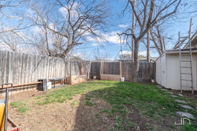 view of yard with a fenced backyard