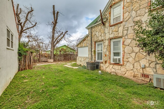 view of yard featuring central AC unit