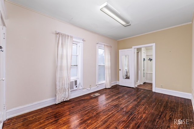 unfurnished room with ornamental molding and dark hardwood / wood-style floors