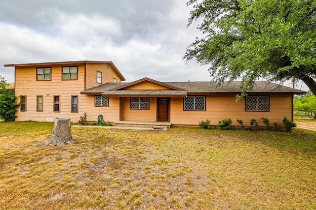 view of front of home with a front lawn