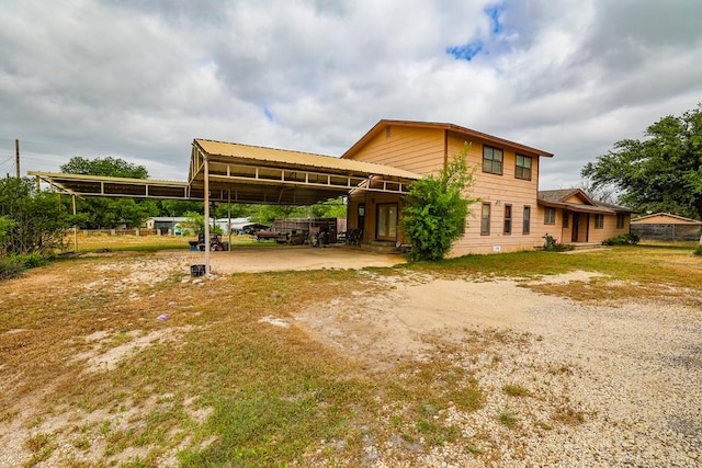 exterior space with a carport