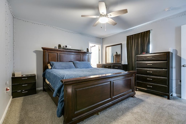 bedroom with ceiling fan, carpet flooring, and baseboards