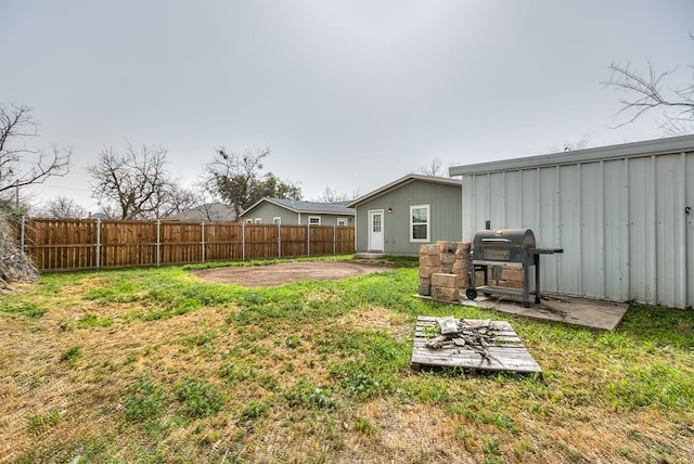 view of yard with a fenced backyard