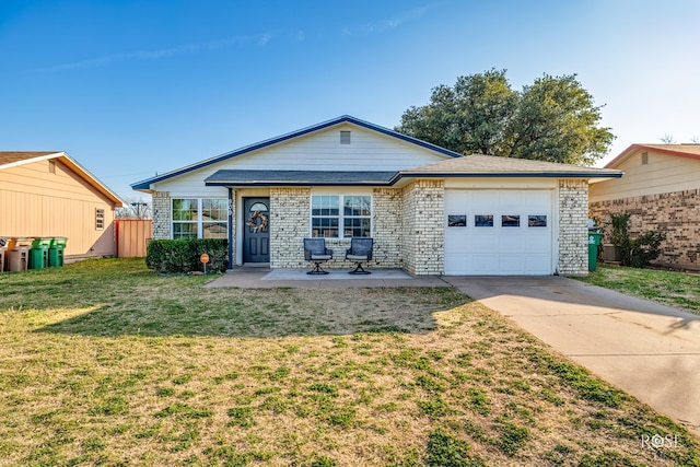 ranch-style home with an attached garage, concrete driveway, a front yard, and brick siding