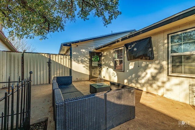 view of patio / terrace featuring fence and a gate