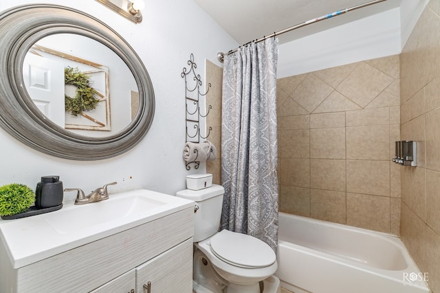 bathroom featuring toilet, shower / bath combo with shower curtain, and vanity