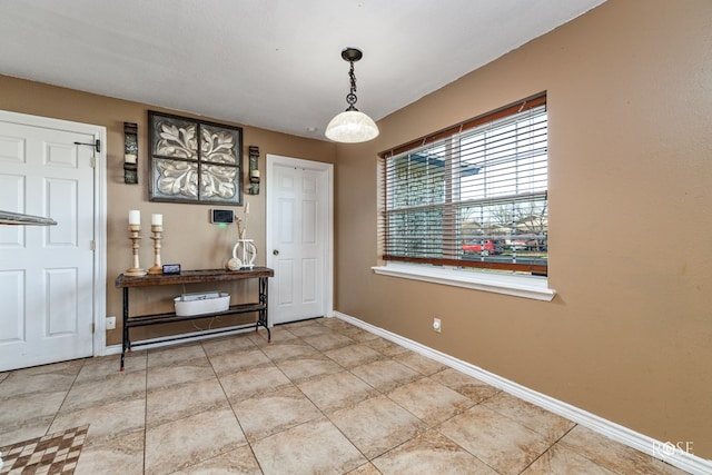 interior space featuring baseboards
