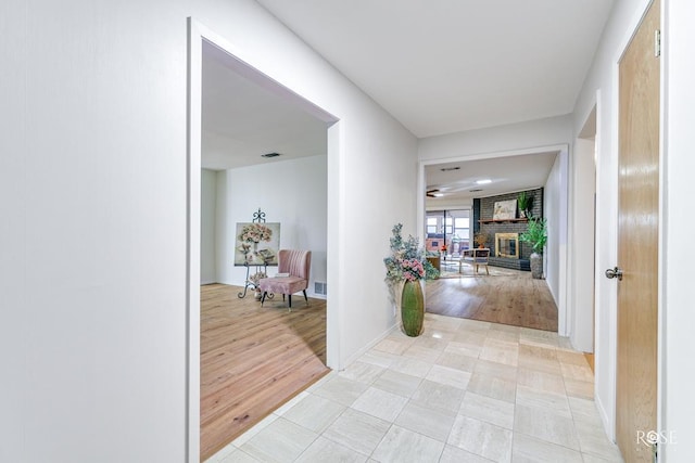 hallway featuring light tile patterned flooring