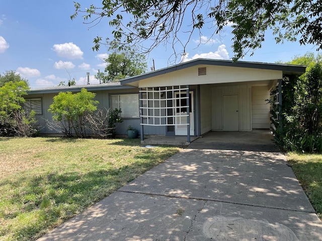 131 Oakwood St, San Angelo, TX 76903 - view of front of home featuring a front yard, concrete driveway, and an attached carport