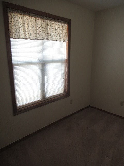 unfurnished room featuring a wealth of natural light