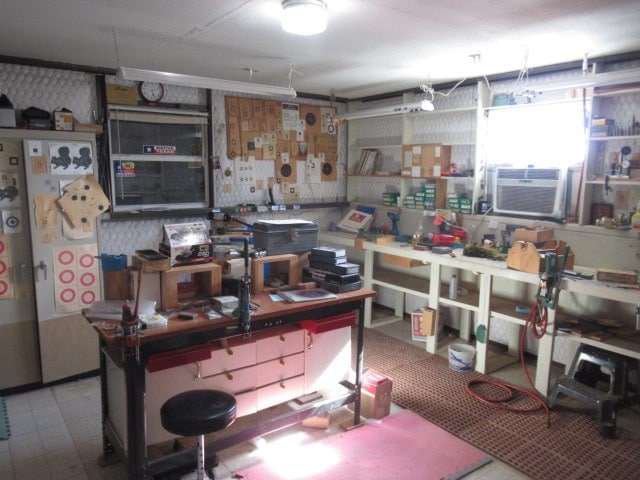 interior space featuring cooling unit and a workshop area