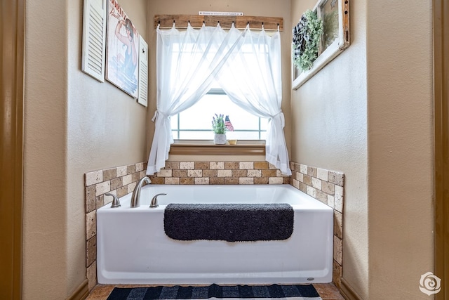 3537 Buck Run, San Angelo, TX 76901 - full bath with a textured wall and a bath