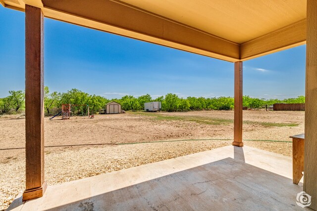 3537 Buck Run, San Angelo, TX 76901 - view of patio / terrace with a storage shed and an outdoor structure