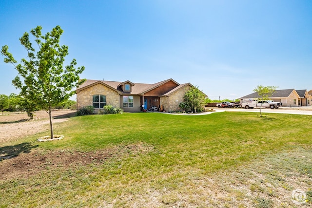 3537 Buck Run, San Angelo, TX 76901 - ranch-style home featuring stone siding and a front yard
