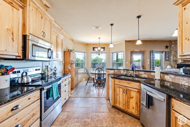 3537 Buck Run, San Angelo, TX 76901 - kitchen featuring a sink, stainless steel appliances, light brown cabinets, crown molding, and visible vents