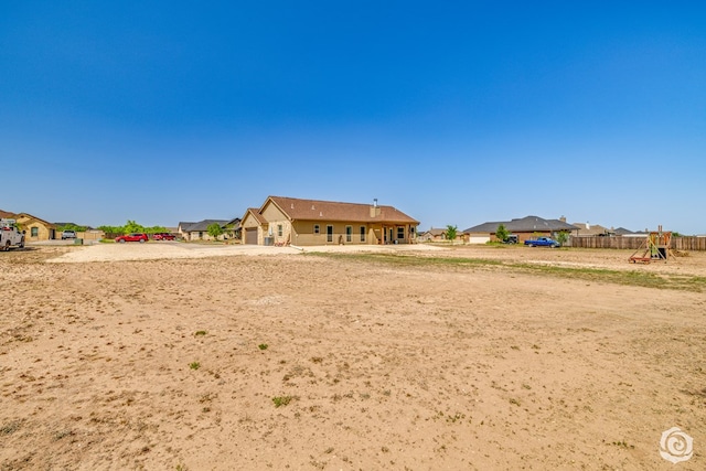 3537 Buck Run, San Angelo, TX 76901 - exterior space featuring driveway, an attached garage, and playground community