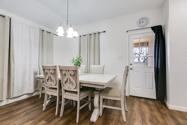363 E 49th St, San Angelo, TX 76903 - dining area with a chandelier, dark wood-type flooring, and baseboards