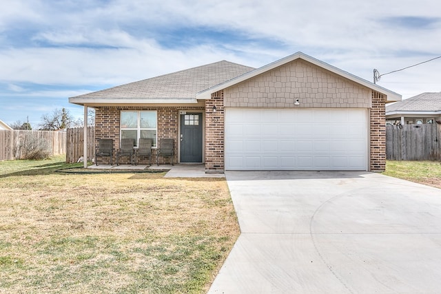 363 E 49th St, San Angelo, TX 76903 - single story home featuring driveway, an attached garage, roof with shingles, and brick siding