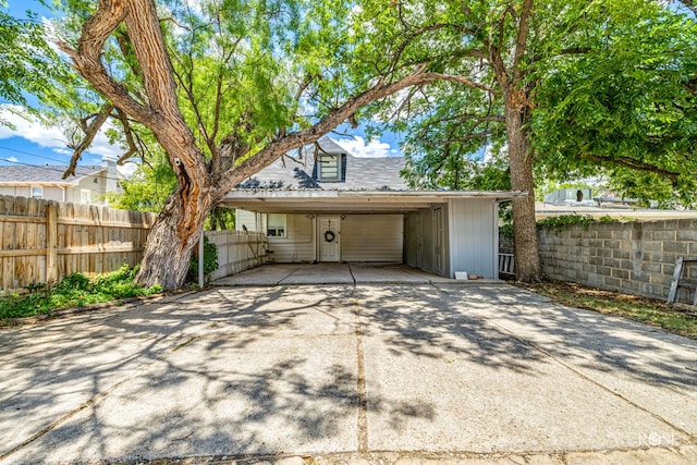 garage featuring a carport