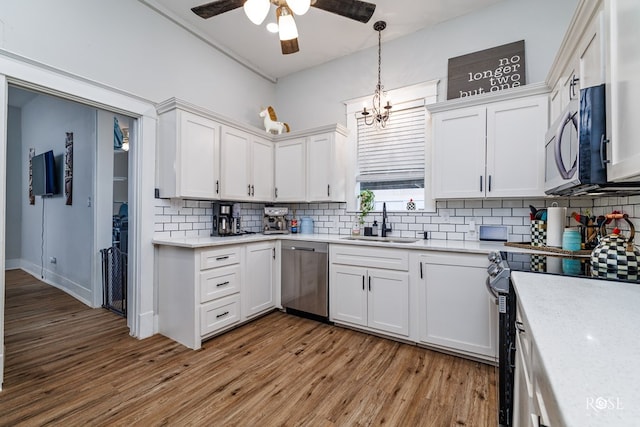 kitchen featuring white cabinetry, appliances with stainless steel finishes, and sink