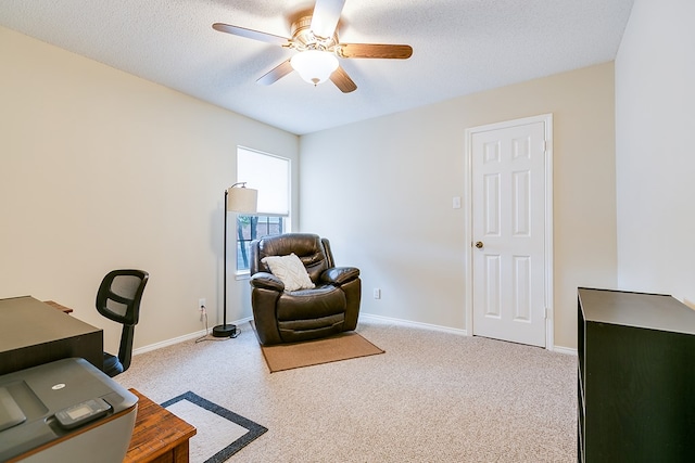 4413 Pinon Ridge Dr, San Angelo, TX 76904 - home office with ceiling fan, light colored carpet, baseboards, and a textured ceiling