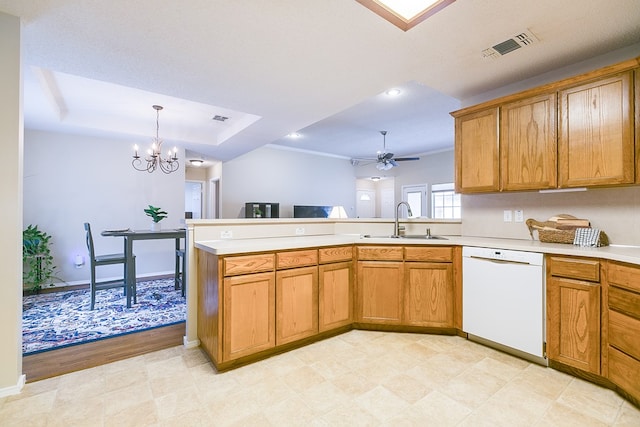 4413 Pinon Ridge Dr, San Angelo, TX 76904 - kitchen featuring white dishwasher, a sink, light countertops, a peninsula, and a chandelier