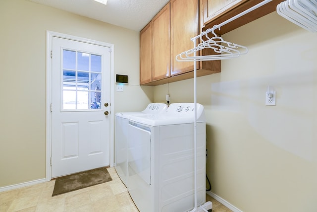 4413 Pinon Ridge Dr, San Angelo, TX 76904 - laundry room featuring cabinet space, washer and dryer, and baseboards
