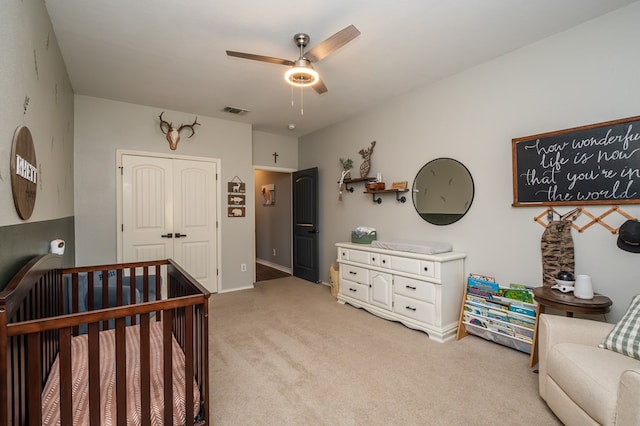 3918 Caroline Ln, San Angelo, TX 76904 - bedroom featuring light colored carpet, a closet, ceiling fan, and baseboards