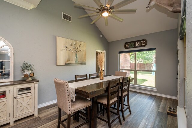 3918 Caroline Ln, San Angelo, TX 76904 - dining area with vaulted ceiling, dark wood finished floors, ceiling fan, and baseboards