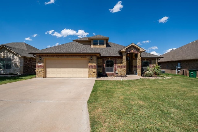 3918 Caroline Ln, San Angelo, TX 76904 - view of front of home with driveway, a garage, a front yard, roof with shingles, and brick siding