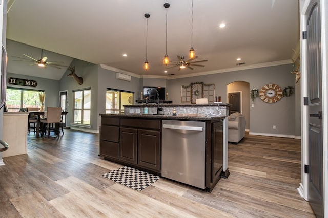 3918 Caroline Ln, San Angelo, TX 76904 - kitchen with dishwasher, a ceiling fan, open floor plan, arched walkways, and ornamental molding