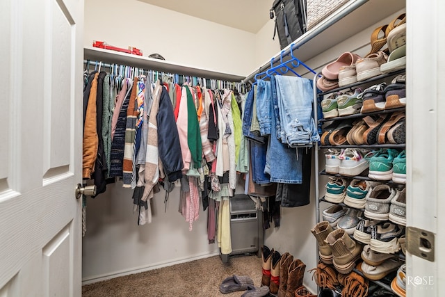 walk in closet featuring carpet floors