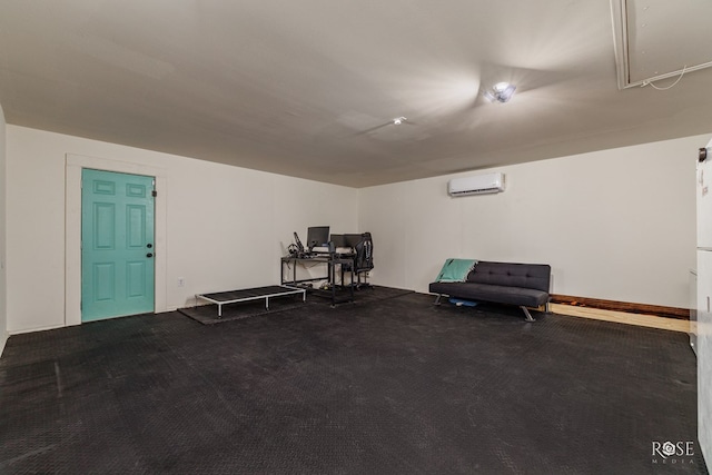 misc room with an AC wall unit and carpet flooring