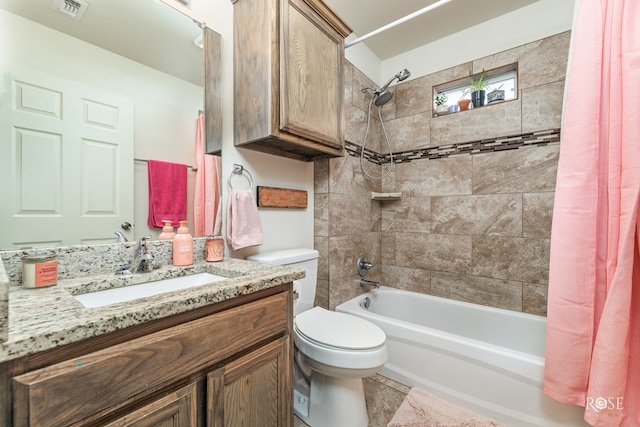 full bathroom with shower / tub combo with curtain, vanity, and toilet