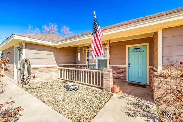 doorway to property featuring covered porch