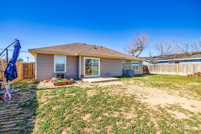 rear view of property with central AC, a lawn, and a patio area