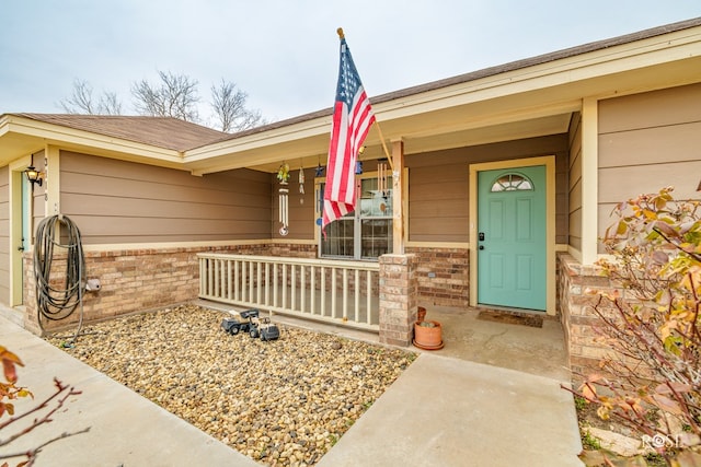 entrance to property featuring covered porch