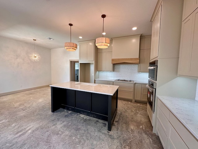 kitchen featuring tasteful backsplash, a kitchen island, stainless steel appliances, light stone countertops, and custom exhaust hood