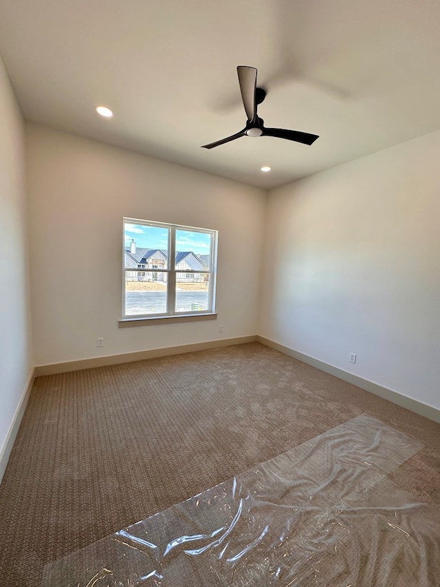 spare room with recessed lighting, baseboards, carpet, and ceiling fan