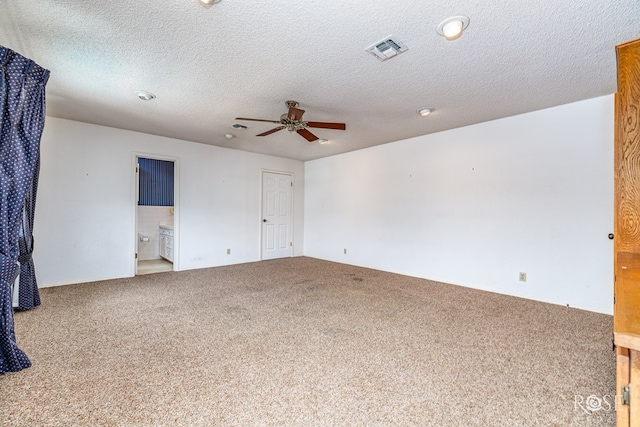 3222 Oak Mountain Trl, San Angelo, TX 76904 - empty room with a ceiling fan, carpet, and a textured ceiling