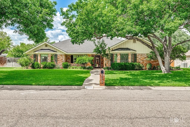 3222 Oak Mountain Trl, San Angelo, TX 76904 - view of front of house with brick siding and a shingled roof