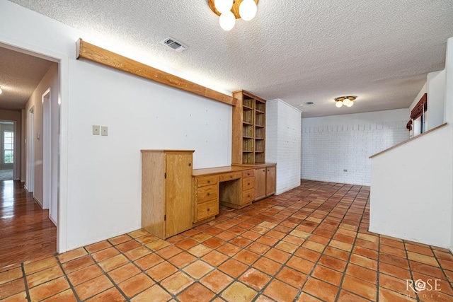 3222 Oak Mountain Trl, San Angelo, TX 76904 - below grade area with a textured ceiling