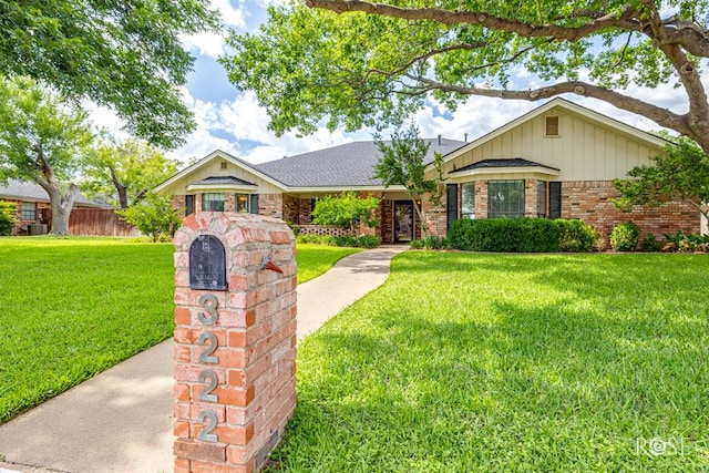 3222 Oak Mountain Trl, San Angelo, TX 76904 - ranch-style home with brick siding and a front lawn