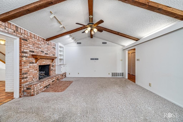 3222 Oak Mountain Trl, San Angelo, TX 76904 - unfurnished living room featuring a textured ceiling, a ceiling fan, a brick fireplace, and carpet flooring
