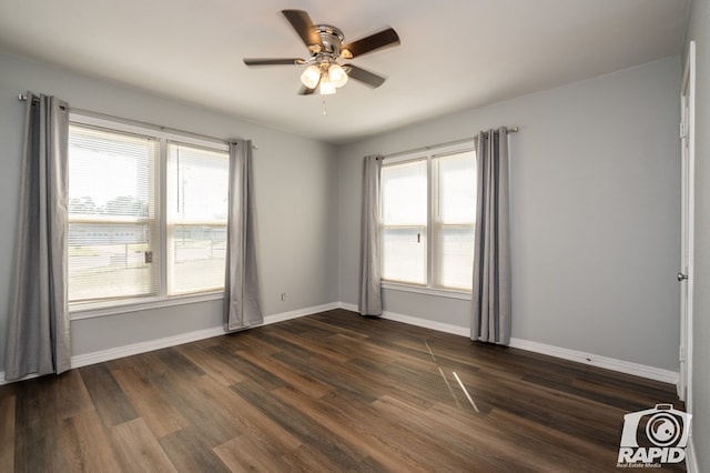 unfurnished room with dark wood-type flooring, ceiling fan, and plenty of natural light